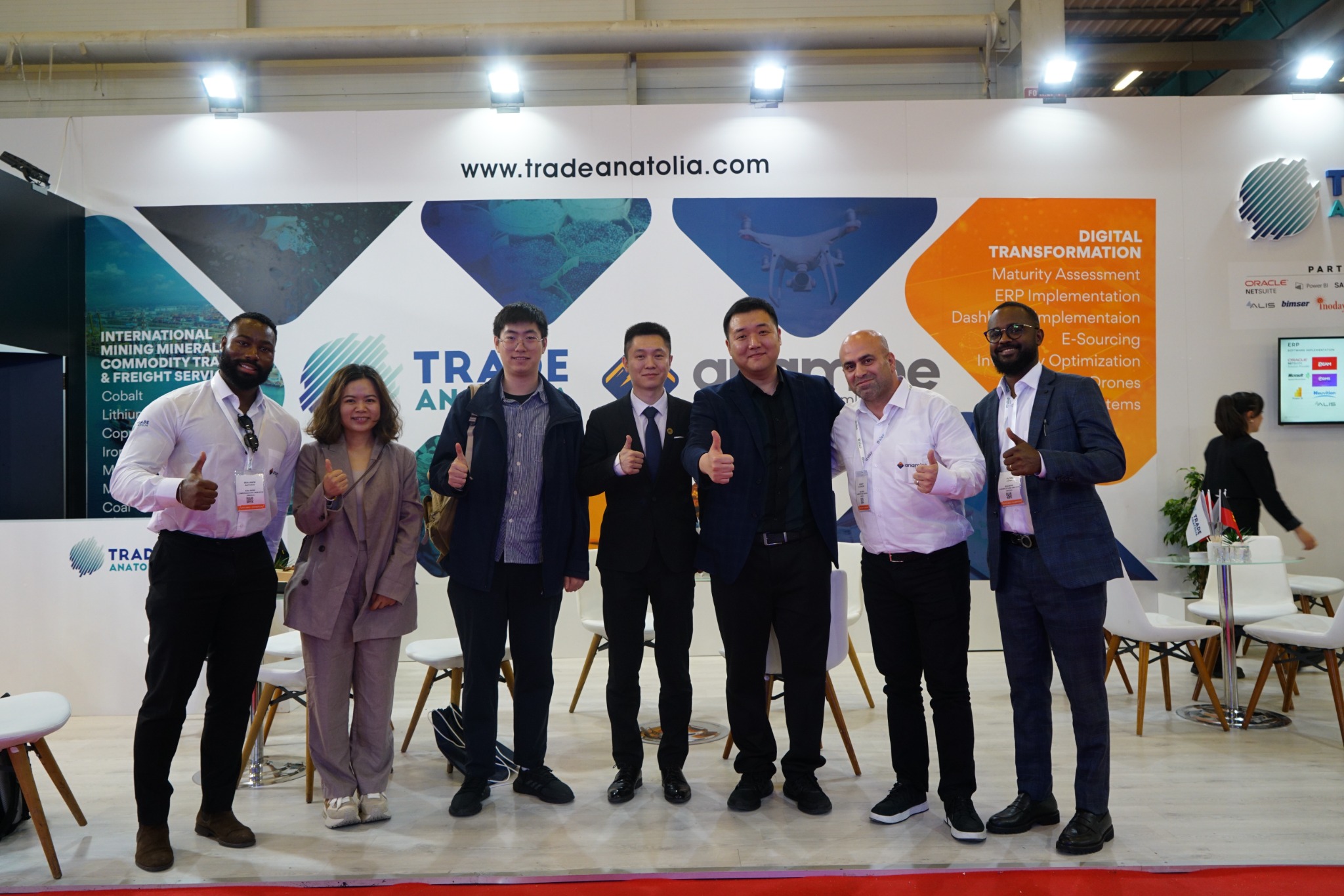 Visitors and team members at the exhibition stand