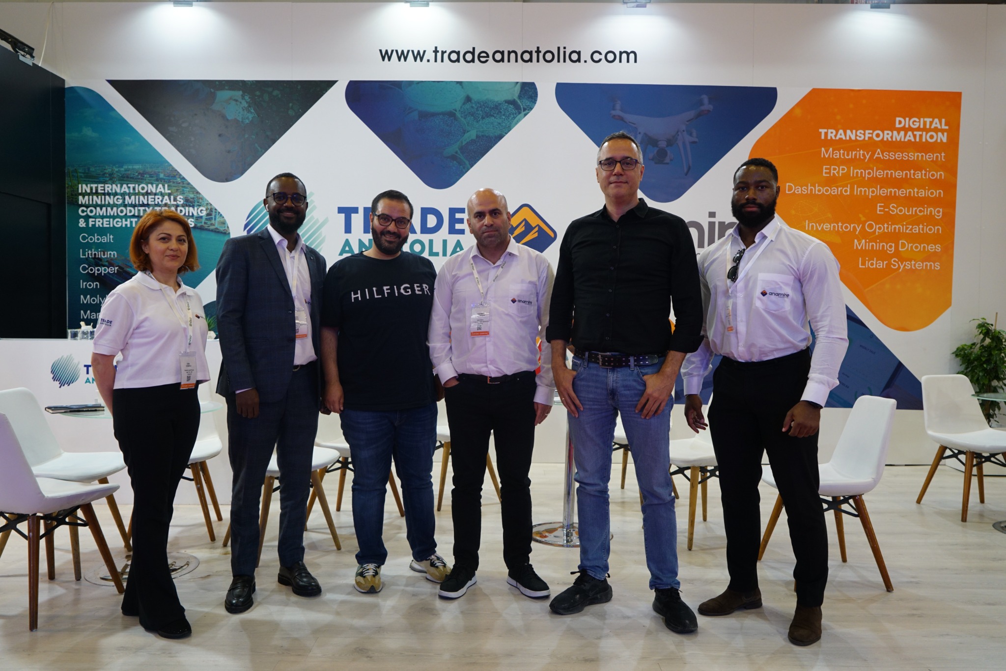 Group photo with guests at the exhibition stand
